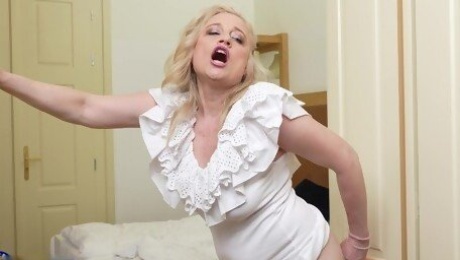 Mature BBW moans while fingering her shaved puss - Andrea V.