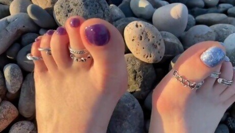 Hot and sexy feet of Mistress Lara in the sunset on public beach